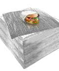 Stack of 14 By 16 Inch Aluminum Foil Sandwich Wrap Sheets 100 Pack with a wrapped sandwich on top, showcasing heat resistant insulation