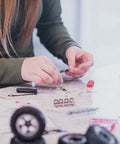 Hands assembling the Beast Mode Erector Set Metal Model Kit For Adults Teens And Advanced Kids Build Cars Planes And Excavators