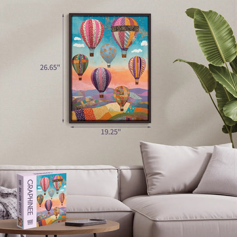 Framed 1000 Piece Jigsaw Puzzle For Adults Hot Air Balloon Scene displayed above couch, box nearby, size 26.65x19.25 inches.