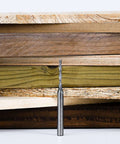 SpeTool extra-long spiral router bit, 1/8 in cutting diameter, 1/4 in shank, solid carbide, front view with wood boards.