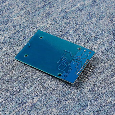 Mifare RC522 NFC Reader Module Kit With S50 White Card And Key Ring on blue surface, back view showing circuits and pins