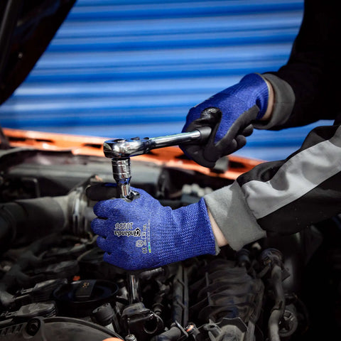 Person using wrench while wearing Level 5 Cut Resistant Work Gloves With Nitrile Palm Grip For Dry To Oily Surfaces