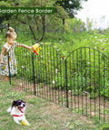 Child near Rustproof Metal Garden Fence Kit With 5 Panels And 6 Stakes, 28 Inch High By 11.7 Feet Long, No Dig Animal Barrier For Dogs, Yard Flower Bed Patio Outdoor, Black