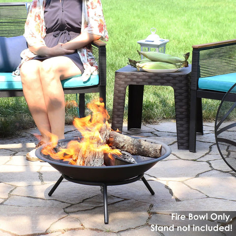 Round 23 Inch Wood Burning Fire Pit Insert in use on patio with logs burning, showing portable lightweight fire bowl for outdoor DIY.