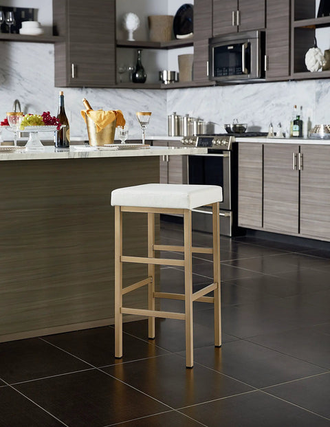 Backless Bar Stool With Gold Frame And White Vinyl Cushioned Seat 30 Inch Counter Height in modern kitchen setting