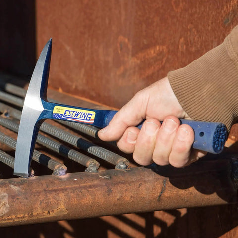 Workhorse Welding And Chipping Hammer With Forged Steel Construction And Shock Reduction Grip 14 Oz USA Made Slag Removal Tool For Welds And Metalworking Dual Sided Chisel And Precision Tip E3WC in use on metal surface