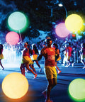 People holding 16 Inch Light Up Glow Beach Ball With 8 LED Modes For Night Pool Fun, Waterproof LED Ball For Adults Teens And Kids.