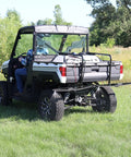 Back view of UTV with 40 Gallon UTV Broadcast Sprayer With 2.2 GPM Diaphragm Pump And 10 Foot Swath Regulated Flow System in field