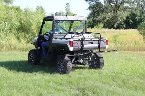 Back view of UTV with 40 Gallon UTV Broadcast Sprayer With 2.2 GPM Diaphragm Pump And 10 Foot Swath Regulated Flow System in field