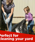 Mother and daughter using 65 Gallon Heavy Duty Trash Bags 50x60 Inches Extra Large Black Contractor Liners for yard cleanup
