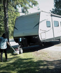 Force 5K Electric Trailer Dolly for RV, Boat and Cargo Trailers moving a travel trailer on grass with ease.