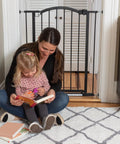Extra Tall Decor Safety Gate For Kids And Pets, Fits 28.75 To 39.75 Inch Openings, 36 Inch Tall Walk Through Gate in doorway with mother and child reading