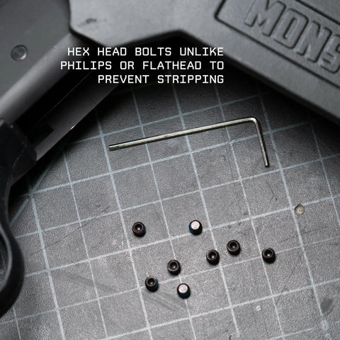 Gun Plug Screw Set For Rifle And Shotgun Receivers That Snaps Into Factory Optics Ports, hex head bolts on grid surface.
