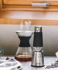 Portable Electric Coffee Grinder With Stainless Steel Burrs And Nine Precision Settings For Espresso To French Press in kitchen setting.