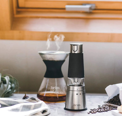 Portable Electric Coffee Grinder With Stainless Steel Burrs And Nine Precision Settings For Espresso To French Press in kitchen setting.