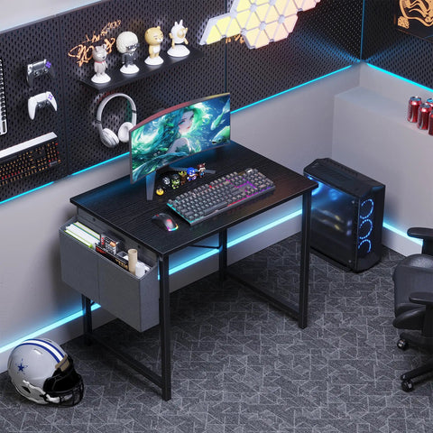 Space Saving Computer Desk For Small Spaces 31 Inch Home Office Table For Gaming And Study With Large Surface And Sturdy Steel Frame Includes Storage Bag For Bedroom Black in modern gaming setup with monitor and accessories.
