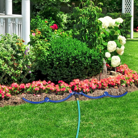 360 Degree Tree Watering Ring Kit For New Trees And Shrubs With Y Hose Splitter installed in garden with colorful flowers