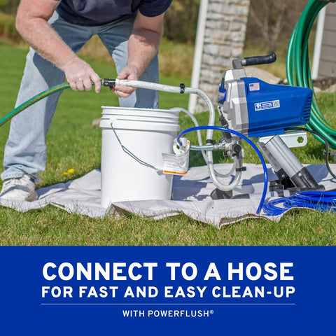 Pro Grade Airless Paint Sprayer With Fully Adjustable Pressure and a rugged stainless steel piston pump connected to a hose for cleanup.