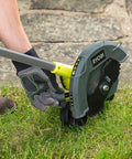 18V ONE Plus Cordless Edger Bare Tool with 22cm Serrated Edging Blade being used for lawn edge trimming