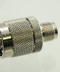 Close-up of Reverse Polarity TNC Female To N Male RF Adapter Pro Grade with nickel plated body and gold RF pin