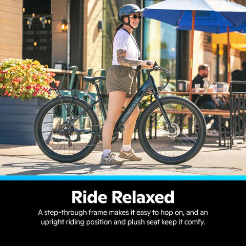 Woman standing beside Electric Hybrid Bike With 350W Hub Motor, 27-Inch Wheels, Throttle Or Pedal Assist, Up To 20 MPH, Dope Daily Commute Cruiser For Adults, Lightweight Blue Frame Built For Easy Hills And All Day Comfort on street