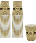 Two stacks and a single 8 ounce disposable paper coffee cup for hot beverages to go leak resistant and sturdy with leaf pattern.