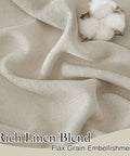 Close-up of rich linen blend fabric with flax grain embellishment, showcasing textile texture and quality with cotton bolls.