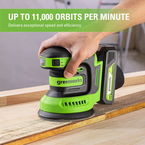 Person using Cordless 24V 5-Inch Random Orbital Sander Kit With Variable Speed on wood, highlighting low-vibration feature.