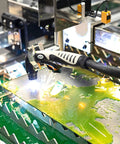 Versa-Cut 2 By 2 CNC Plasma Table in action cutting metal sheet with sparks, featuring LCD touch screen and 10 Gal Waterbed capacity.