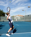 Tennis player wearing A60 Ankle Support Brace For Right Foot White Medium With Side Stabilizers Molded At Sixty Degree on court