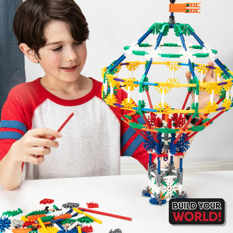 70 Model Building Set With 705 Pieces For STEM Learning And Creative Play, Ages 7 And Up, Amazon Exclusive Craft Kit For Endless Builds And Hands On Engineering Fun. child assembling colorful K'NEX model