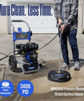 Man using gas pressure washer 3400 PSI 2.6 GPM with 212cc engine, 15 inch surface cleaner on driveway, soap tank, and spray gun visible.
