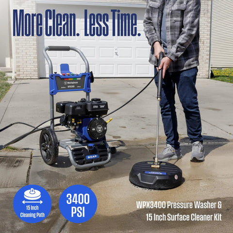 Man using gas pressure washer 3400 PSI 2.6 GPM with 212cc engine, 15 inch surface cleaner on driveway, soap tank, and spray gun visible.