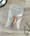 3x4 Inch Clear Zipper Reclosable Bags, 6 Mil Heavy Duty Storage Bags Pack Of 100, FDA Food Safe Transparent LDPE For Organization And Food Prep For Grab And Go Kitchen Or Office Storage holding a fishing lure