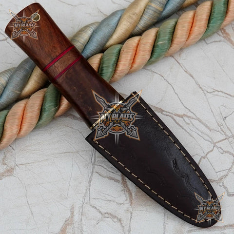 Damascus Steel Fixed Blade Camping Knife With Walnut Wood Handle Brass Bolster And Leather Sheath Included Hand Forged High Carbon Outdoors Gear Built Tough For Survival in sheath