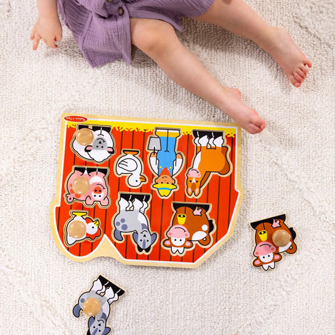 Toddler playing with Farm Animals Jumbo Knob Puzzle For Toddlers Wooden Peg Puzzle For Early Learning Shape Recognition And Fine Motor Skills Cow Pig Horse On Colorful Barnyard Scene Kid Friendly Educational Toy For Ages 1 And Up