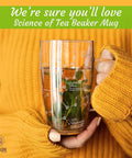 Person holding Chemistry Glass Tea Cups Set Of 2 18 Oz Beaker Mugs With Tea Molecule Etchings Science Of Tea Glass Tumblers