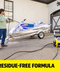 Man using All In One Vehicle Wash And Wax Soap For Pressure Washers Heavy Duty Clean And Shine Universal Fit on a jet ski