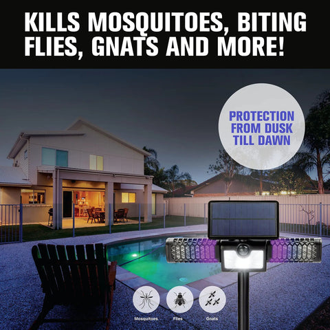 Solar Powered 2in1 Bug Zapper And Flood Light installed outdoors, illuminating a backyard patio and pool area at night.
