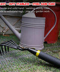 Five Claw Hand Rake And Weeder Cultivator For Small Gardens, Heavy Duty Stainless Steel Tines, Ergonomic Handle next to a watering can.