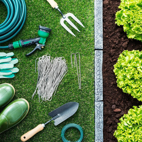 100 Pack Drip Irrigation Staples, J Shape Garden Stakes, 5 Inch Lawn Pins for Securing Half Inch Drip Tubing, Landscaping Stakes for Outdoor Garden displayed with garden tools on grass