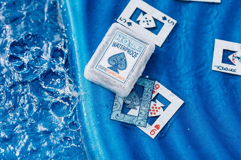 Waterproof Plastic Playing Cards Deck on blue surface with water splashes, ideal for outdoor fun beach pool camping travel games.