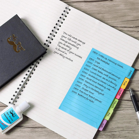 Neon Sticky Notes Set 410 Pack with 150 Neon Index Tabs and Divider Pads on open notebook with text for planning organization