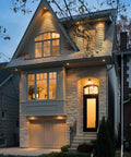 Top Shelf 6 Inch LED Recessed Downlights With Adjustable Color Temperature illuminating a modern home exterior at dusk.