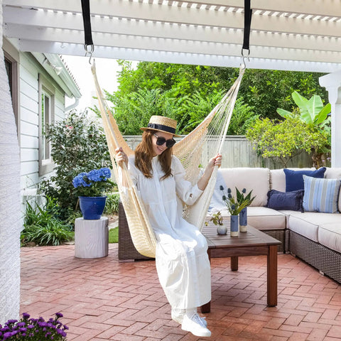 Woman relaxing in XL Hammock Chair With Hanging Hardware No Spreader Bar For Indoor Outdoor Lounging Beige 330 Lbs Weight Capacity.