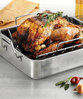 Deep Stainless Steel Roasting Pan With Basting Grill And V Rack For Oven 16.5 Inch Turkey Roaster, loaded with a roasted turkey