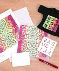 EasySubli Printable Sublimation Heat Transfer Vinyl Kit with vibrant designs, mask sheets, and sample tee on a wooden surface.