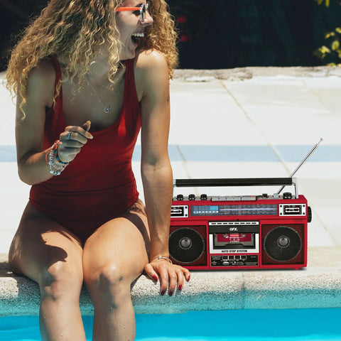 Dope Red Boombox With Bluetooth MP3 Converter From Radio To Cassette by poolside with woman in red swimsuit enjoying music