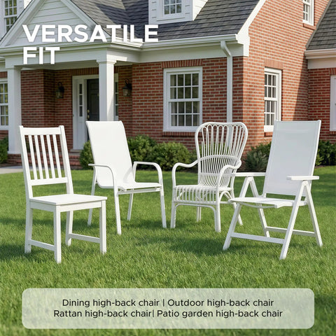 Four white high-back outdoor chairs on grass in front of brick house