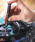 Using Tiny But Mighty Six Piece Magnetic Micro Precision Screwdriver for delicate electronics repair on toy car, hand close-up